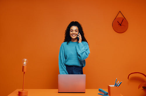 Entrepreneur talking in vibrant monochromatic office