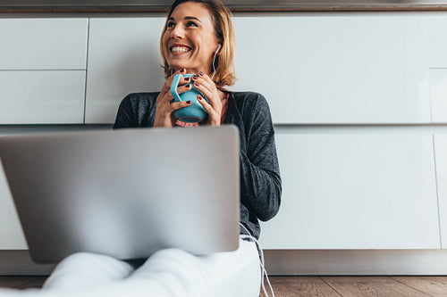 Woman working on laptop computer at home