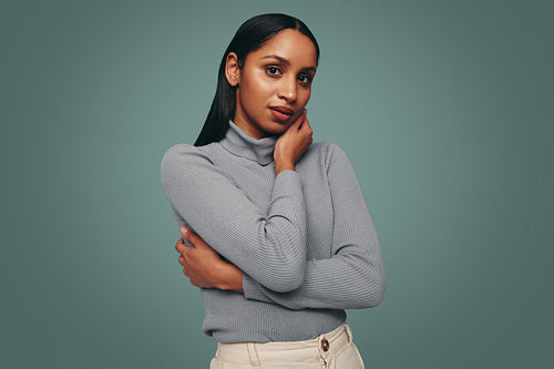 Brunette woman looking at the camera in a studio