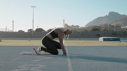 Runner taking off from the starting blocks