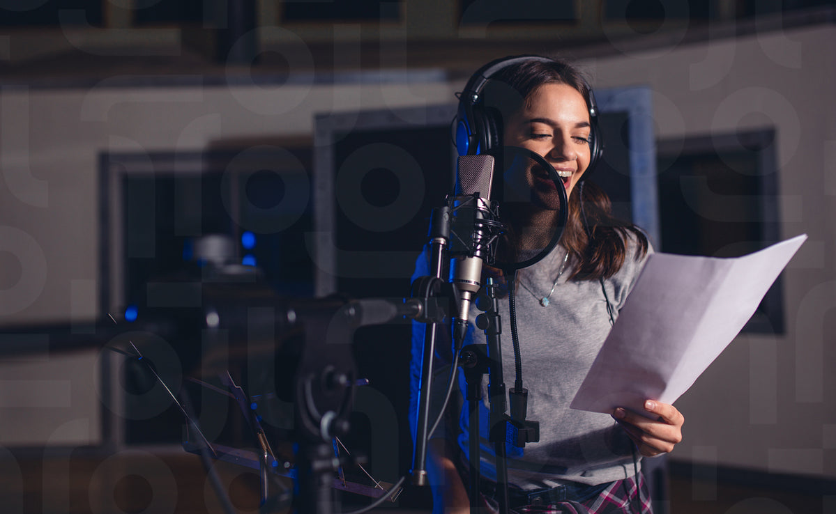 Female singer with microphone and reading lyrics – Jacob Lund ...