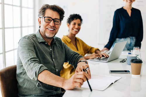 Business man sitting in a meeting at work
