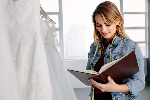Female entrepreneur in bridal clothing store