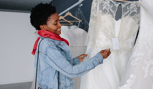 Woman shopping for wedding outfit in bridal boutique