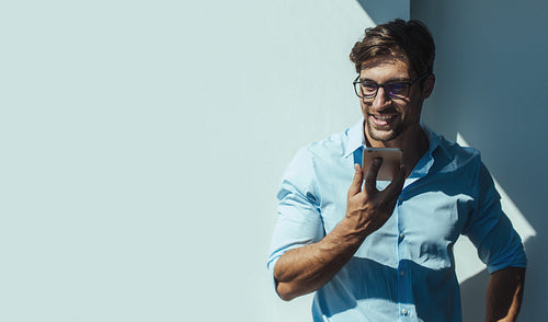 Businessman talking over mobile phone.