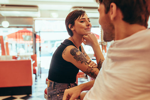 Romantic couple at a restaurant looking at each other