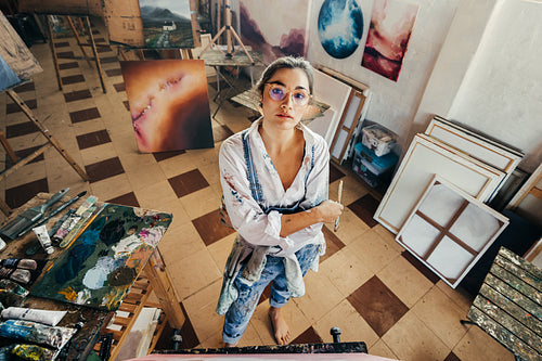 High angle view of an artist looking at the camera