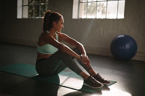 Female at gym taking a break from workout