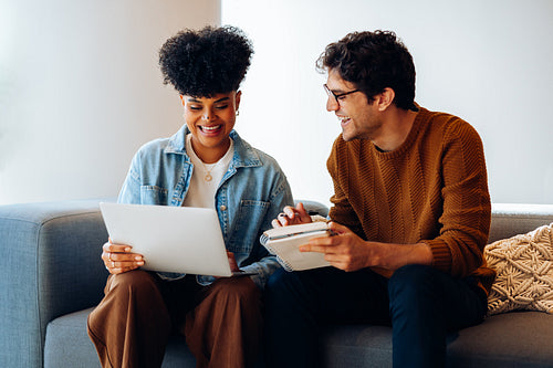 Sharing ideas: Teammates compare notes with enthusiasm