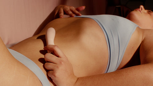 Intimate play: Woman explores sensuality and touch