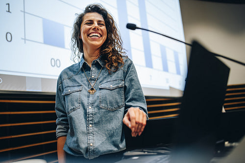 Successful woman speaking at a business summit