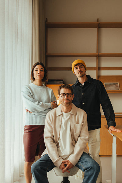 Team of coworkers poses in a contemporary office