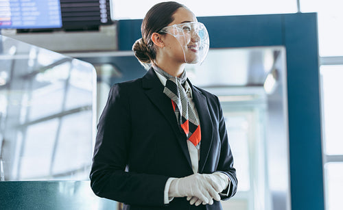 Airlines staff with face shield working at airport