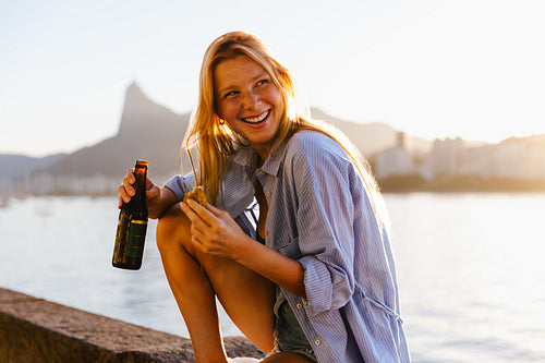 Blonde tourist enjoying a sunny day at Urca’s Wall, Rio de Janeiro