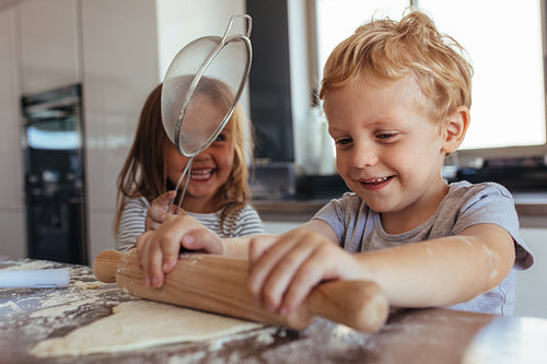 Children making cookies and having fun in the kitchen