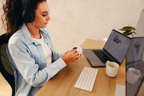 Woman using a timer while working at her desk in a productive setting