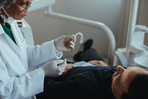 Senior dental consultation with aligner discussion in a modern clinic