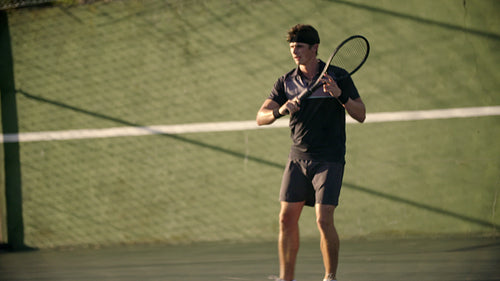 Tennis player playing on a hardcourt