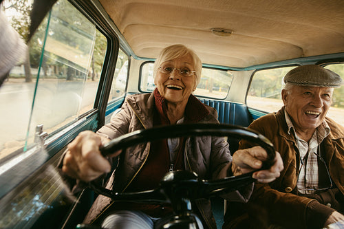 Senior couple having a great time on their drive