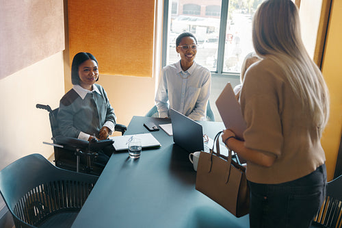 Diverse professionals discussing ideas during a team meeting in a modern workspace