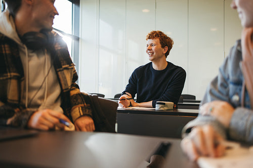 Young man in university classroom