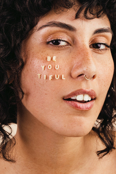 Portrait of a beautiful young woman looking at the camera