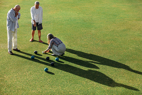 High angle shot of senior persons playing boules