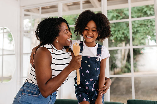 Kitchen fun - Happy mother and daughter laughing together