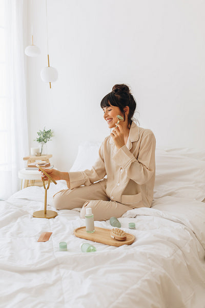 Woman using beauty products at home