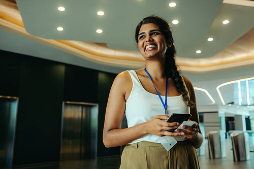 Confident Indian professional in modern corporate environment