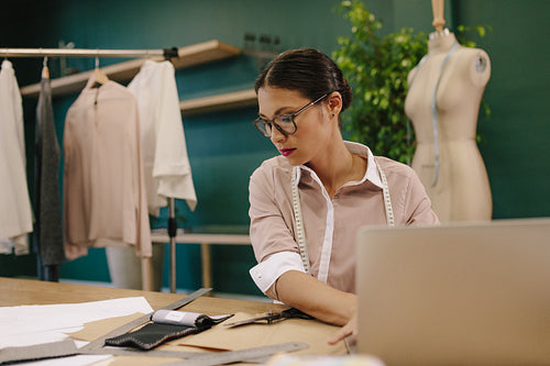 Fashion designer working in her studio