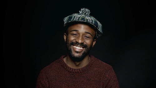 Man in a cap with his eyes closed