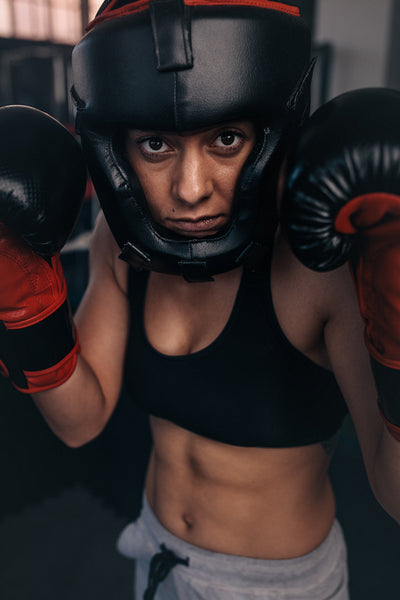 Female boxer geared up for a bout