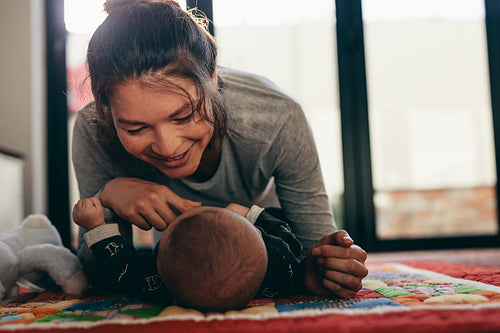 Mother pampering her baby