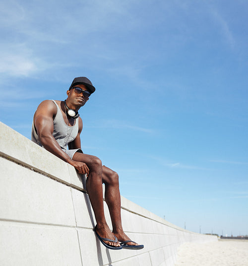 African man sitting on a promenade