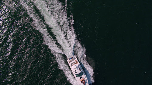 Yacht sailing in the sea with young people on deck