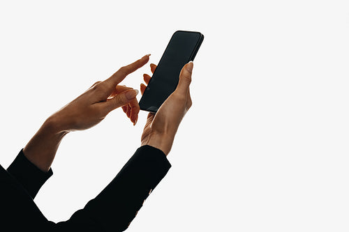 Hands holding smartphone with blank screen for mobile mockups