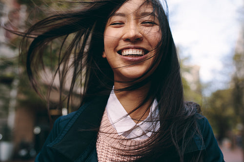 Close up of a smiling asian woman