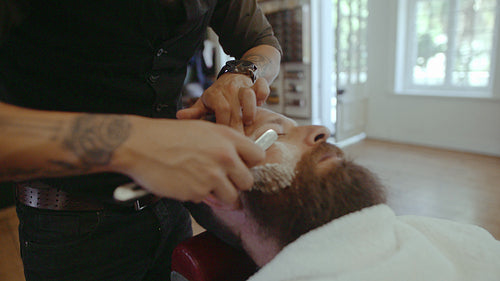 Beard man visiting hairstylist in barber shop