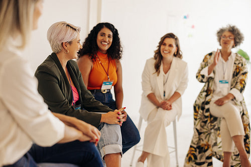 Cheerful businesswomen having a conference meeting in an office