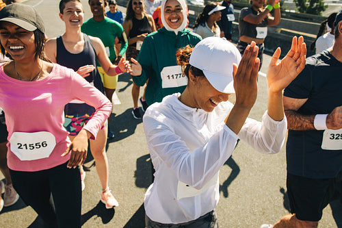 Group of runners showing determination in a supportive race