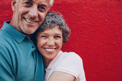 Cheerful mature couple embracing each other