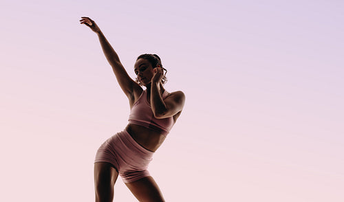 Artistic female dancer demonstrating flexibility and form in a graceful ballet performance