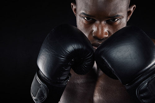 Young male boxer in a fighting stance