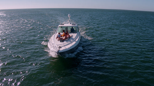 Aerial view of friends relaxing on yacht deck