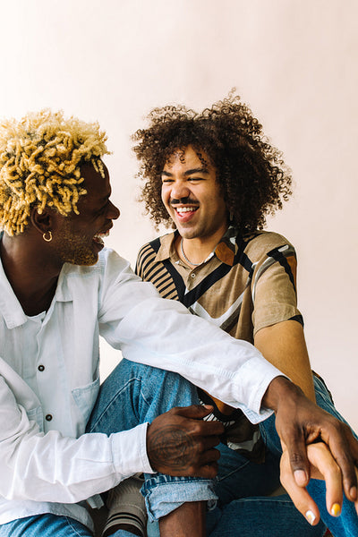 Sweet gay couple sharing a romantic moment in a studio