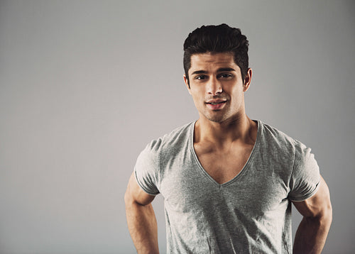 Confident young hispanic male fashion model