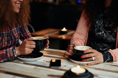 Friends drinking coffee at a cafe