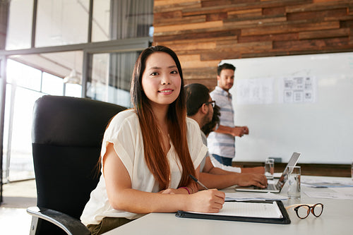 Young woman attending a business presentation
