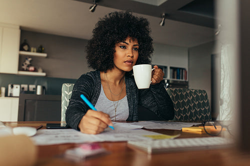 Female architect working at her home office desk